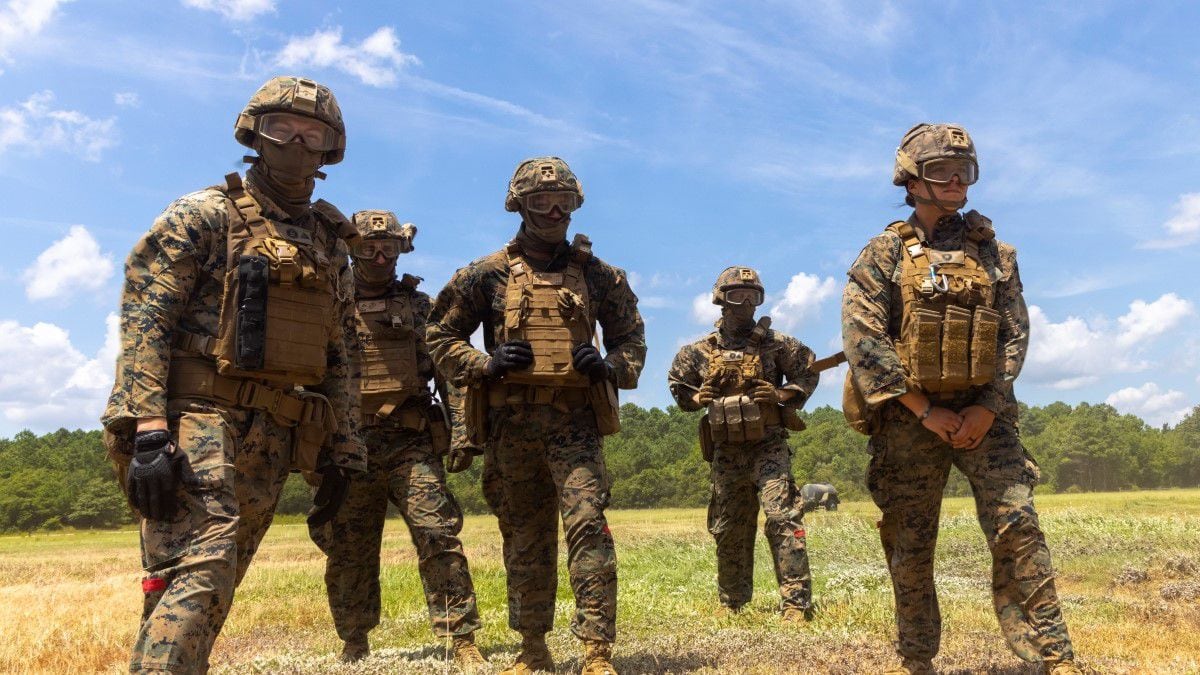 Service members from each branch of the military prepare to march