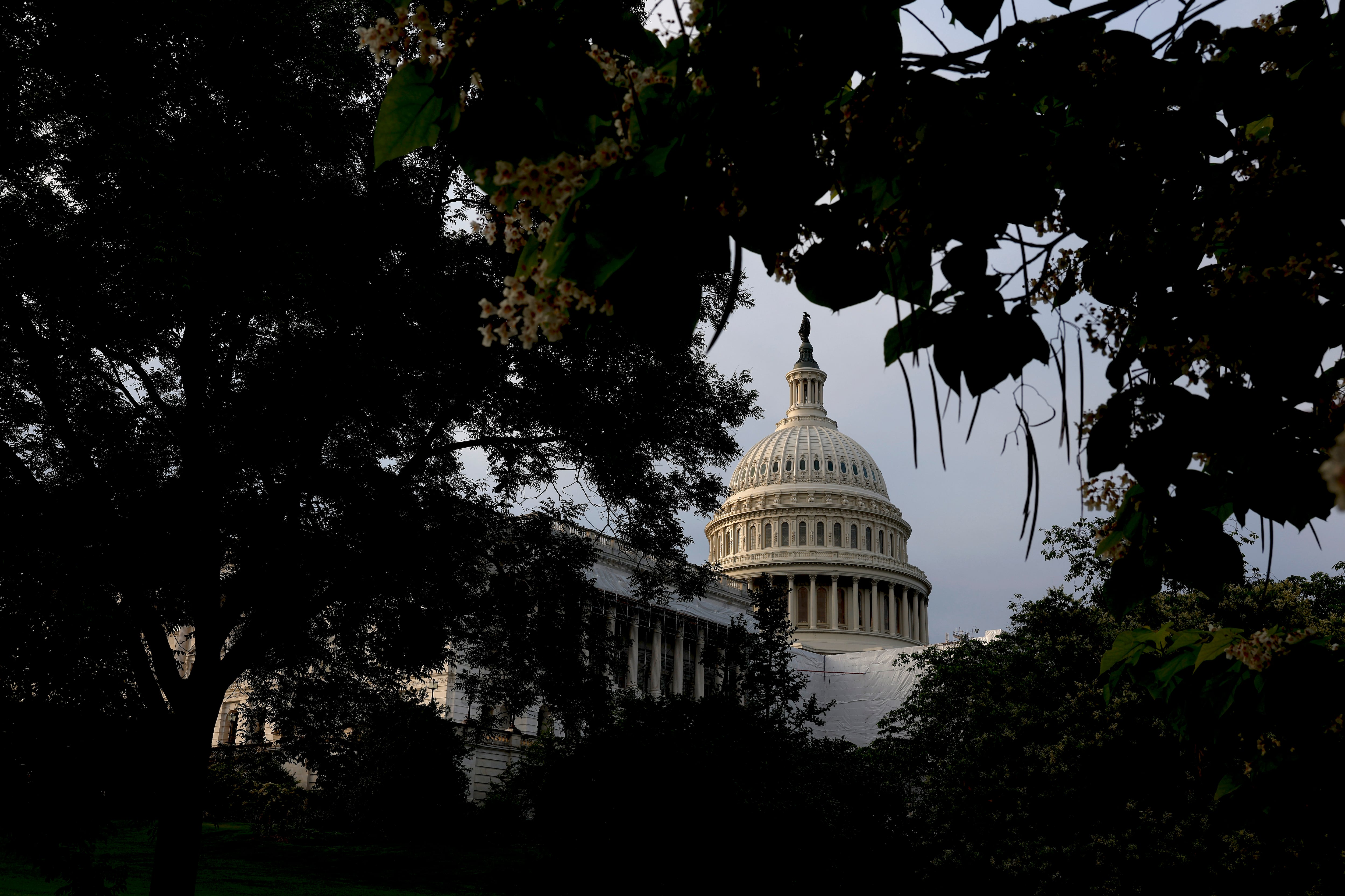 The sun rises behind the U.S. Capitol Building on May 30, 2023 in Washington, D.C.