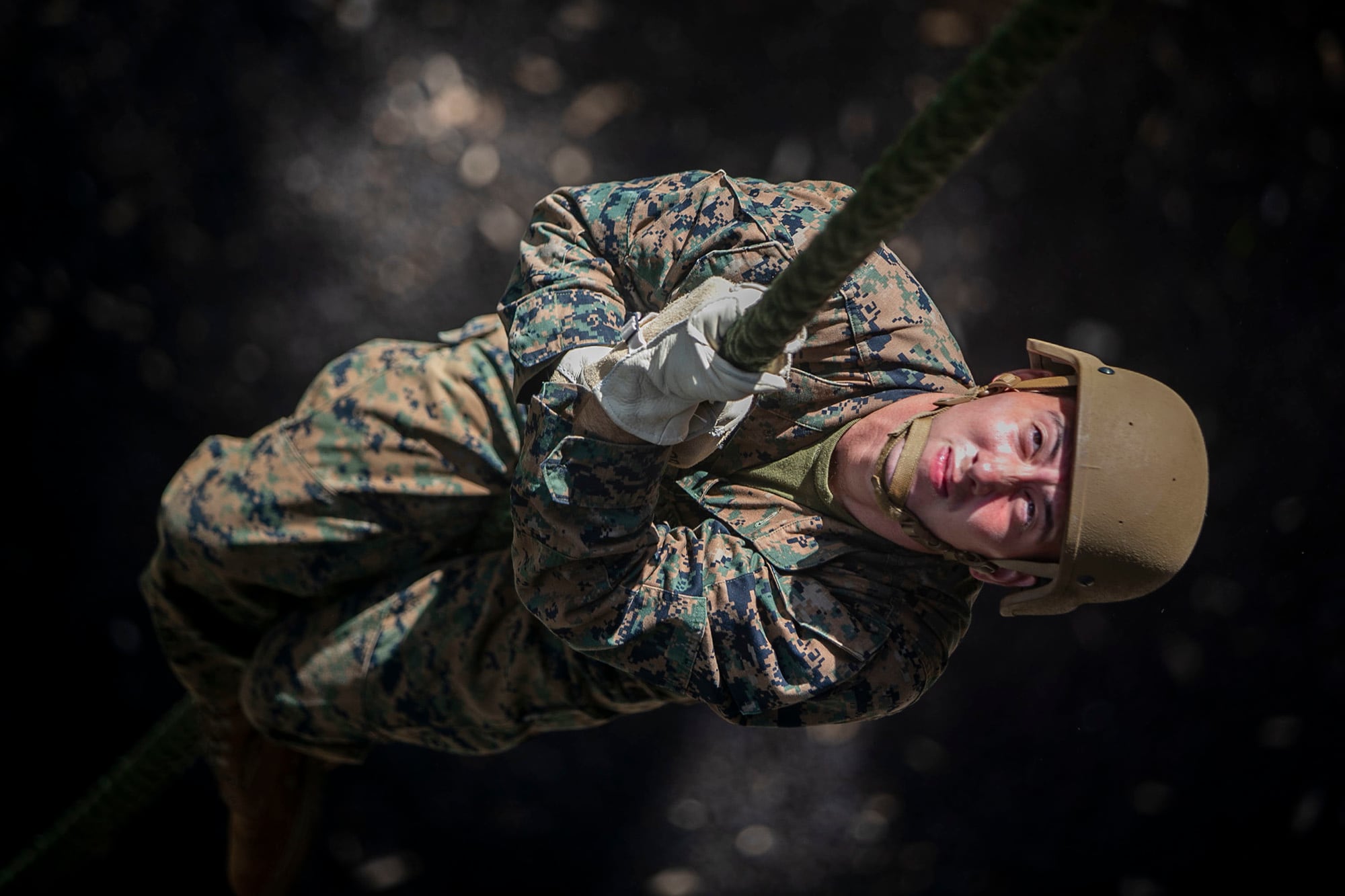 Marine Corps Lance. Cpl. Jonathen Figueroa conducts a fast roping exercise at the Lightning Academy, East Range Training Complex, Hawaii, Aug. 11, 2020.