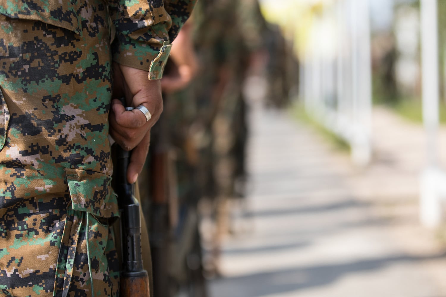 Members of the Syrian Democratic Forces stand in formation during a victory announcement ceremony over the defeat of Daesh’s so-called physical caliphate March 23, 2019, at Omar Academy, Deir ez-Zor, Syria.