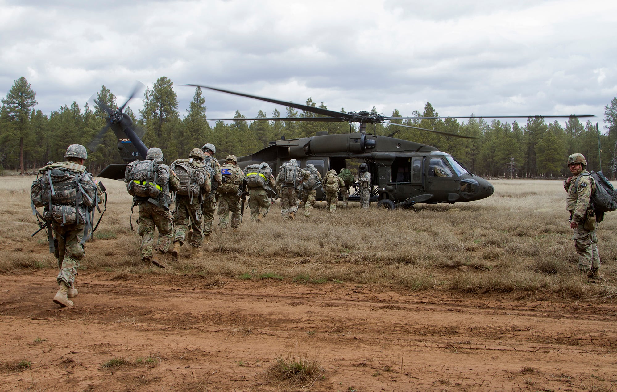 Soldiers board a UH-60 Black Hawk helicopter during an air assault exercise on the first lane of the Arizona National Guard Best Warrior Competition 2019 at Camp Navajo in Bellemont, Ariz., on April 16, 2019.