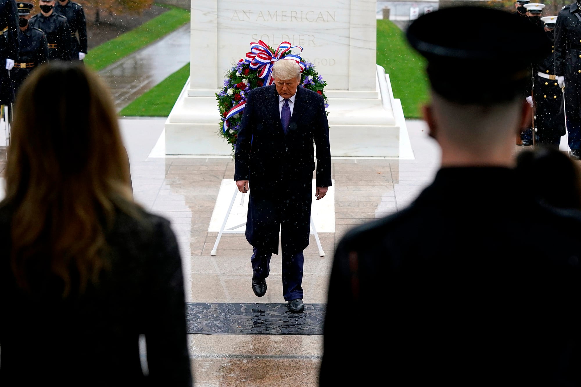 President Donald Trump participates in a Veterans Day wreath laying ceremony at the Tomb of the Unknown Soldier at Arlington National Cemetery in Arlington, Va., Wednesday, Nov. 11, 2020.