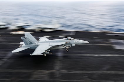 An F/A-18E Super Hornet makes an arrested landing on the flight deck of the aircraft carrier USS Abraham Lincoln (CVN 72) on Aug. 21, 2019, in the Arabian Sea.