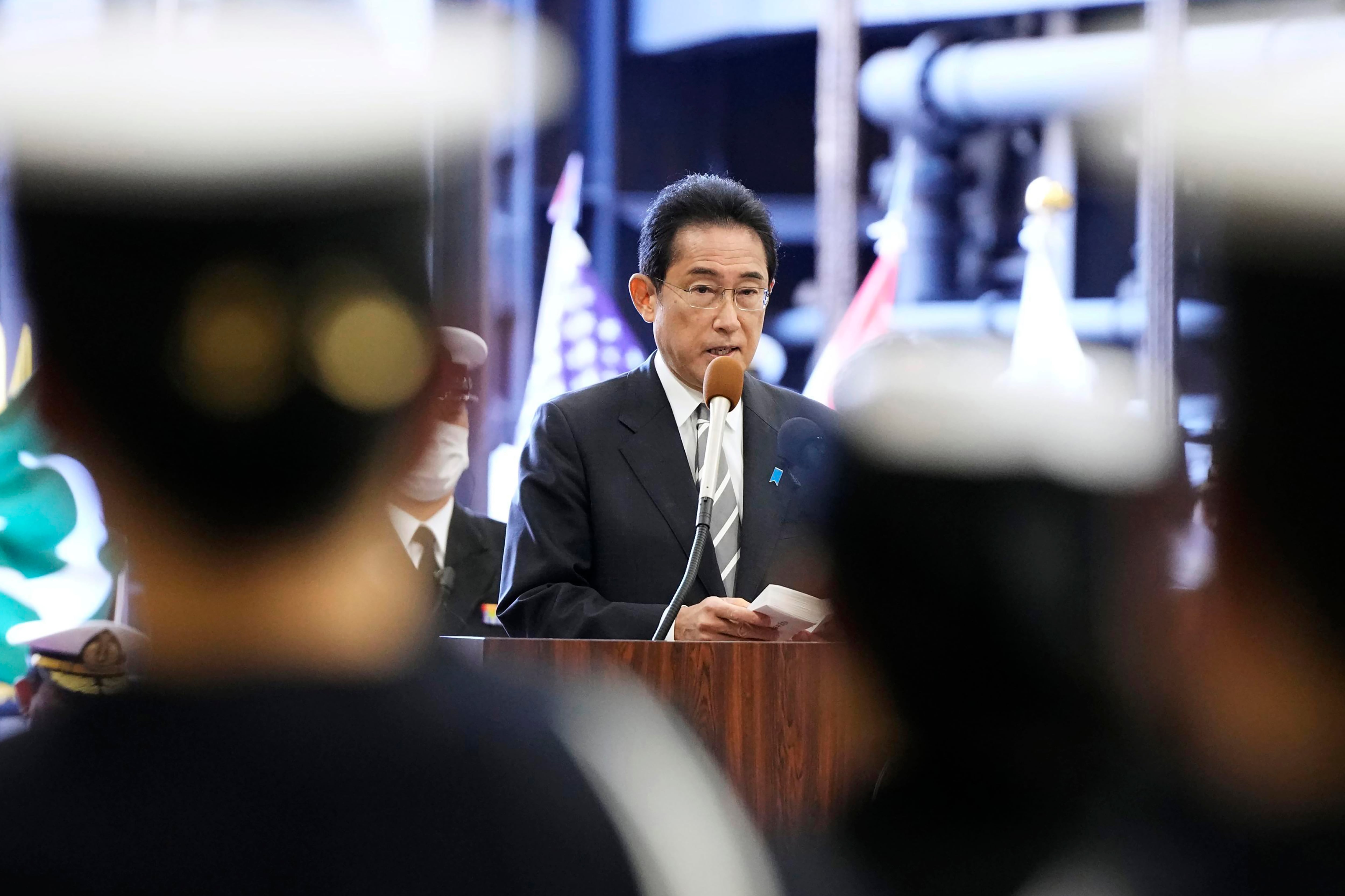 Japanese Prime Minister Fumio Kishida delivers a speech on the Maritime Self Defense Force's helicopter carrier JS Izumo during an international fleet review in Sagami Bay, southwest of Tokyo on Nov. 6, 2022.