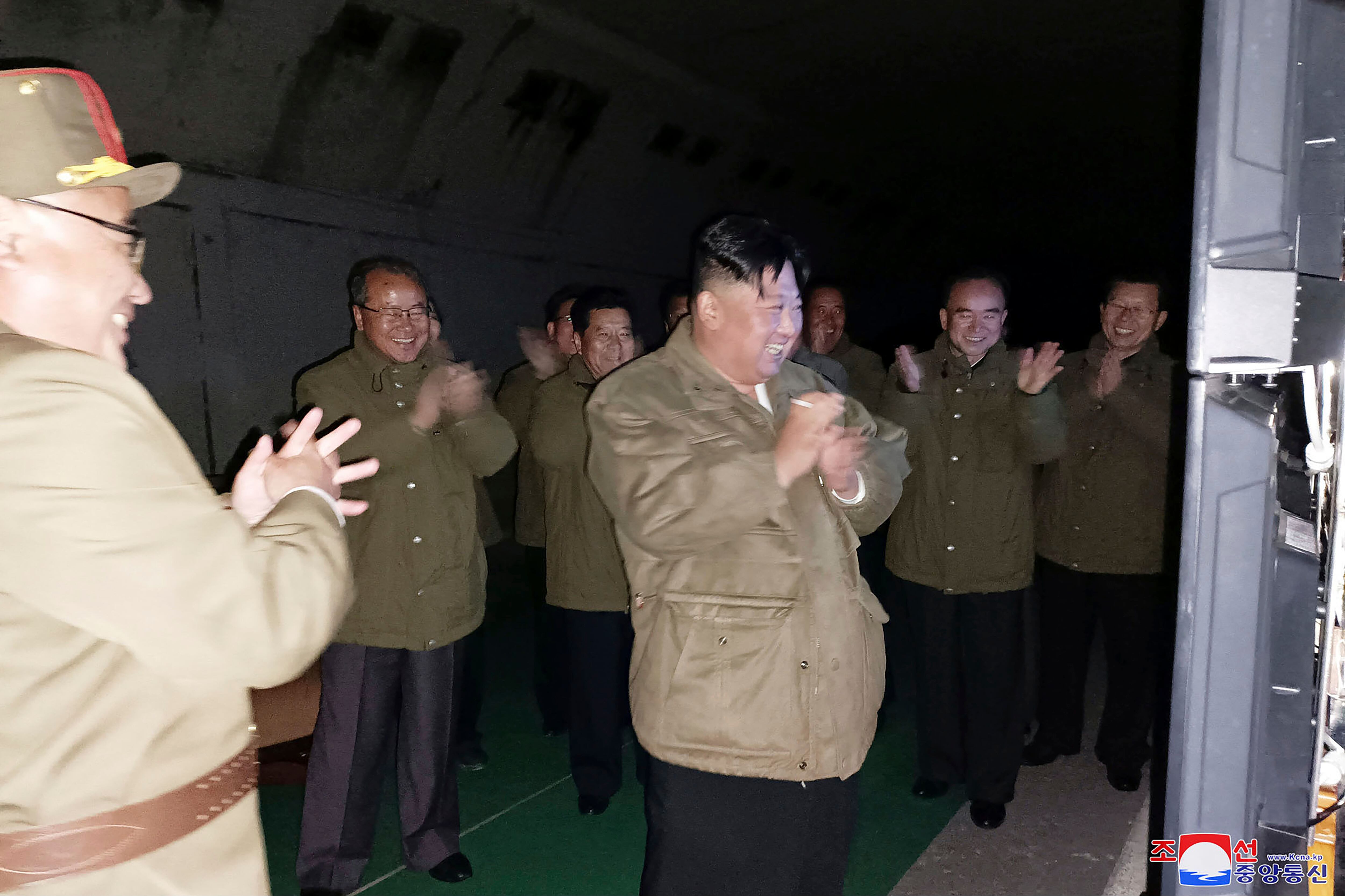 In this photo provided by the North Korean government, North Korean leader Kim Jong Un, center, supervises tests of long-range cruise missiles at an undisclosed location in North Korea Wednesday, Oct. 12, 2022.