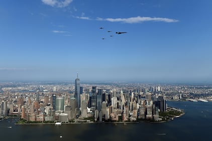 A B-1Lancer flies in formation with four F-35 Lightning II fighters over Manhattan as part of the "Salute to America" on July 4, 2020.