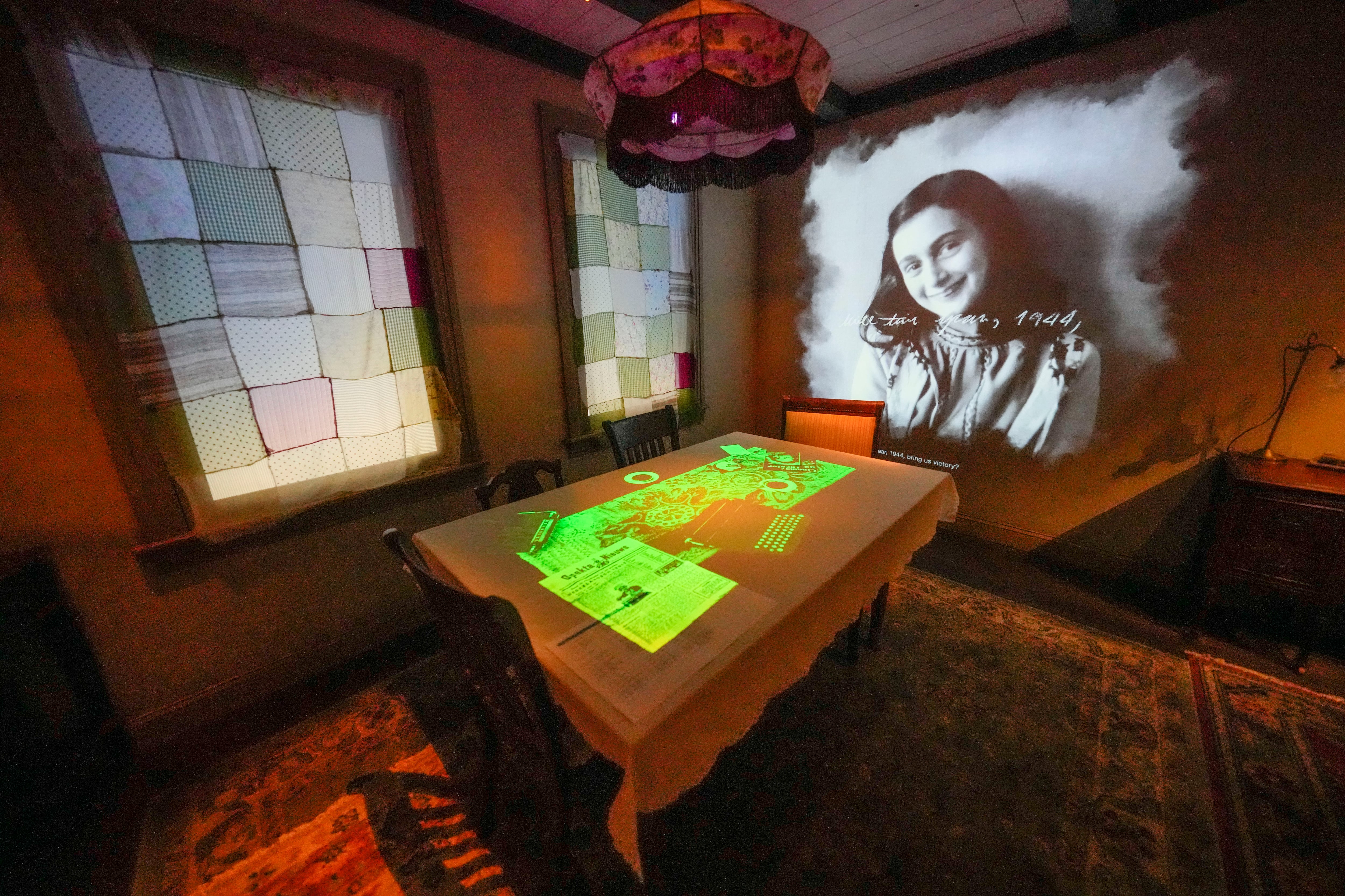 A portrait of Anne Frank is part of a replica of the home in Amsterdam where she hid, as part of the new pavilion opening at the National World War II Museum in New Orleans, Tuesday, Oct. 31, 2023.