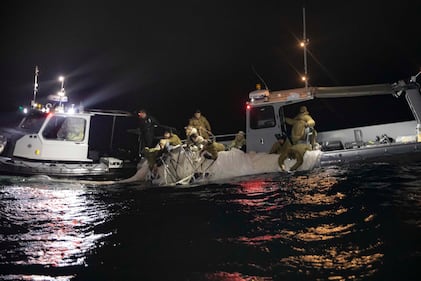 Sailors recover a high altitude surveillance balloon off the coast of Myrtle Beach, South Carolina, Feb. 5, 2023.