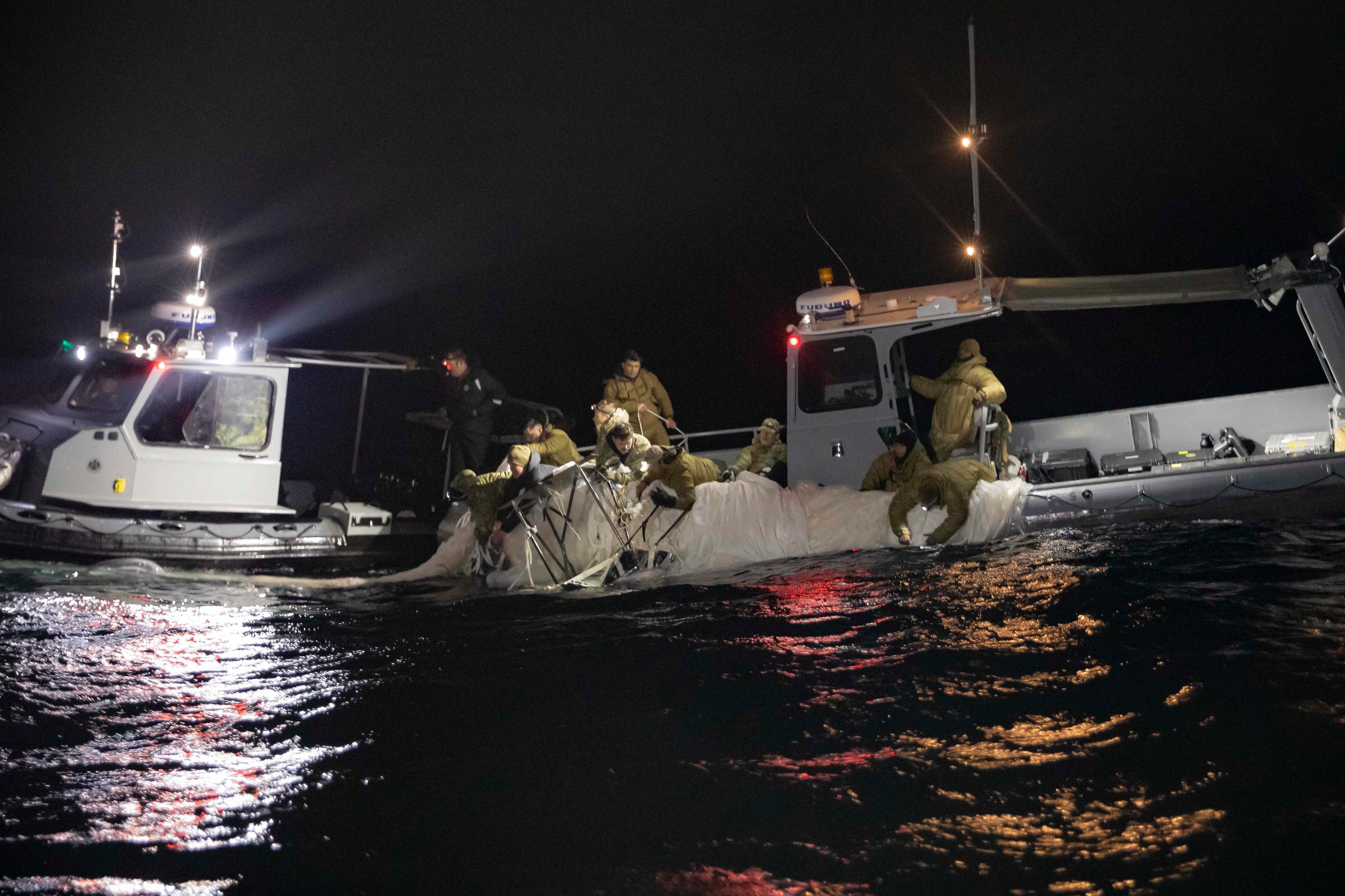 Sailors recover a high altitude surveillance balloon off the coast of Myrtle Beach, South Carolina, Feb. 5, 2023.