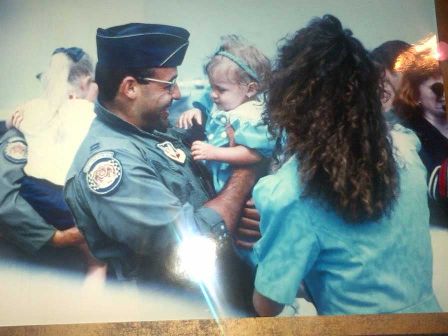 Rodriguez greets his wife, Trish, and his daughter, Amanda, upon his return home from Operation Desert Sto