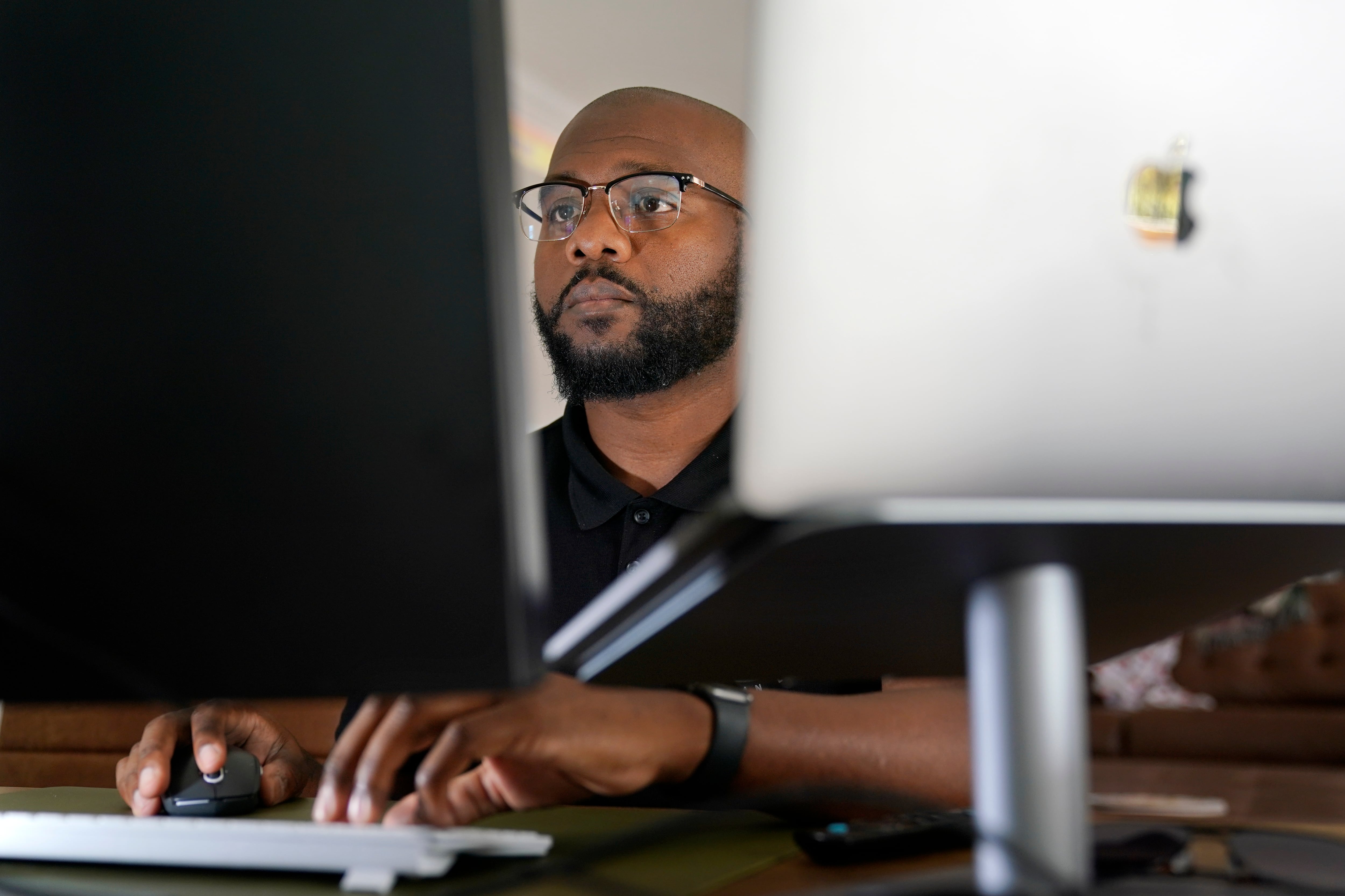 Phillip Slaughter, who served in the U.S. Army for 18 years, works in his home office Nov. 10, 2022, in Clarksville, Tenn.