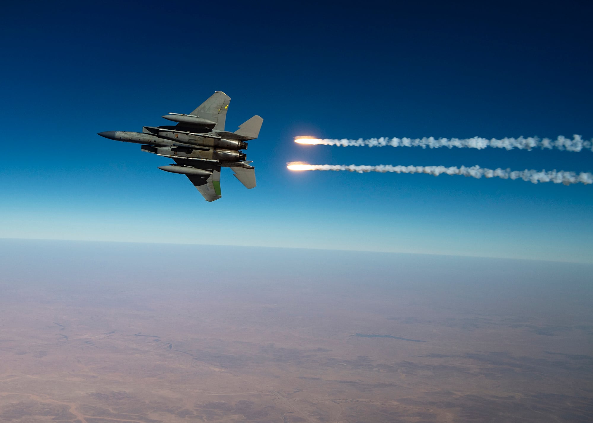 A U.S. Air Force F-15C Eagles release flares over the U.S. Central Command area of responsibility Aug. 13, 2020