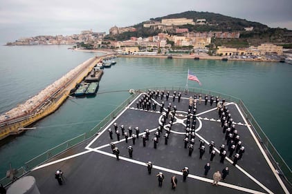 The crew of the USS Mount Whitney stands in formation during the ship’s 50th anniversary celebration in Gaeta, Italy, Jan. 14, 2021.