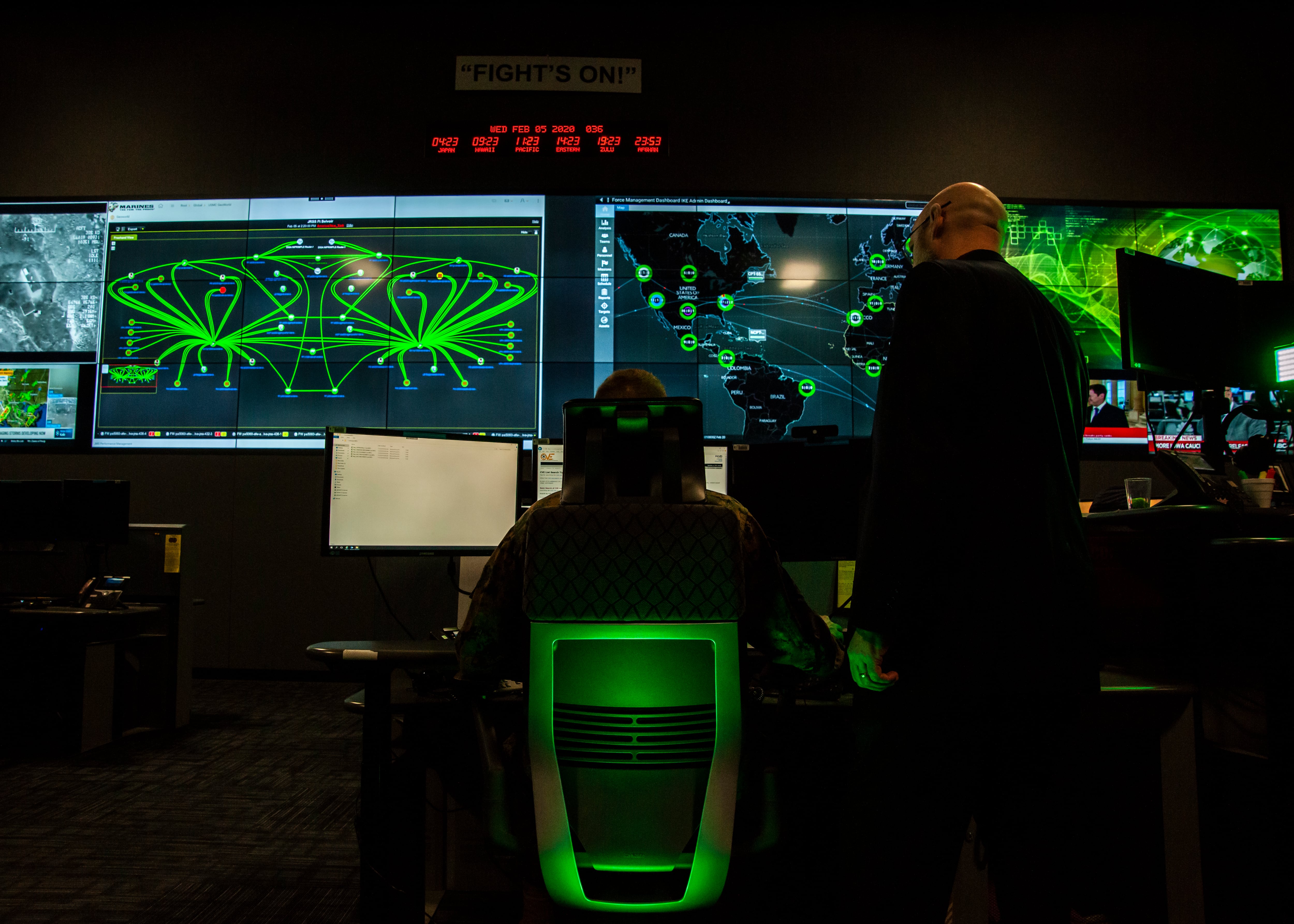 Personnel pose for photos in the cyber operations center at Lasswell Hall aboard Fort Meade, Maryland, Feb. 5, 2020.