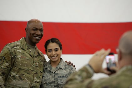 Chief Master Sgt. of the Air Force Kaleth O. Wright poses for a photo with an airman after an all call at Baker Field House on Eielson Air Force Base, Alaska