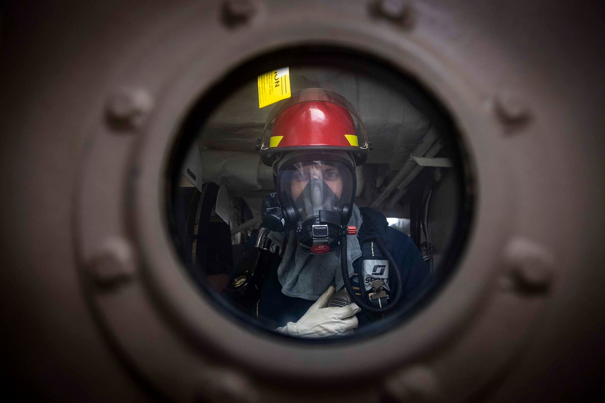 Chief Gunner's Mate Ken Marsh stands by as scene leader during a damage control drill aboard the Freedom-variant littoral combat ship USS Detroit (LCS 7) on July 3, 2020, in the Caribbean Sea.