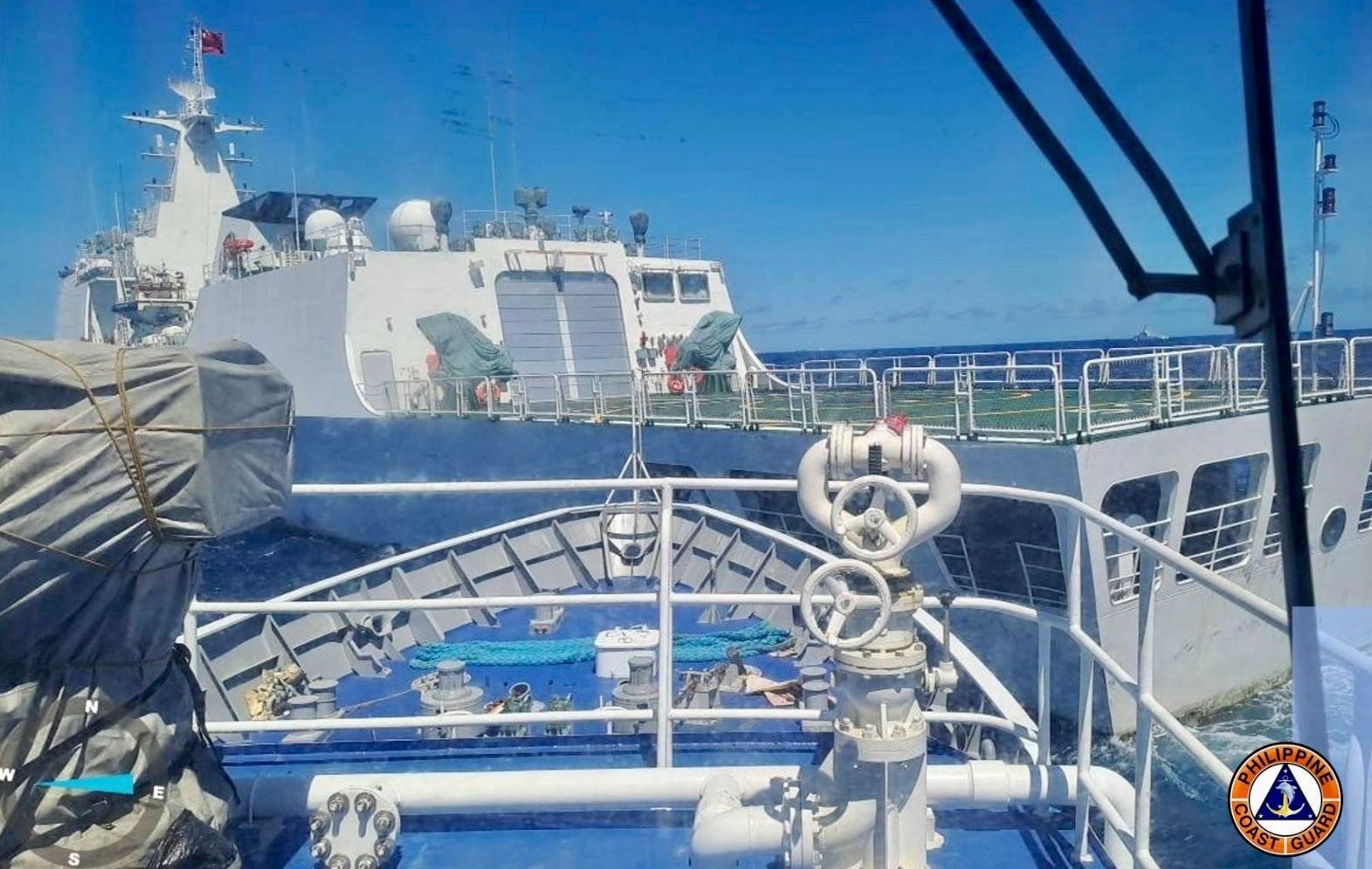 In this photo provided by the Philippine Coast Guard, a Chinese coast guard ship, front, allegedly blocks the path of a Philippine Coast Guard ship near the Philippine-occupied Second Thomas Shoal, South China Sea during a re-supply mission on Saturday Aug. 5, 2023.