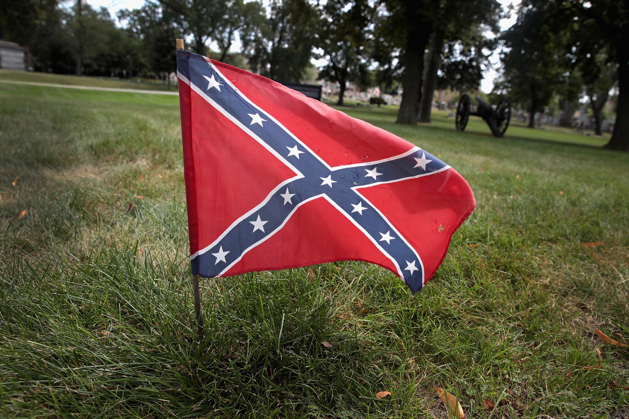 A Confederate Navy jack flag sits at the base of Confederate Mound, a memorial to more than 4,000 Confederate prisoners of war who died in captivity at Camp Douglas and are buried around the monument, on Aug. 23, 2017, in Chicago.