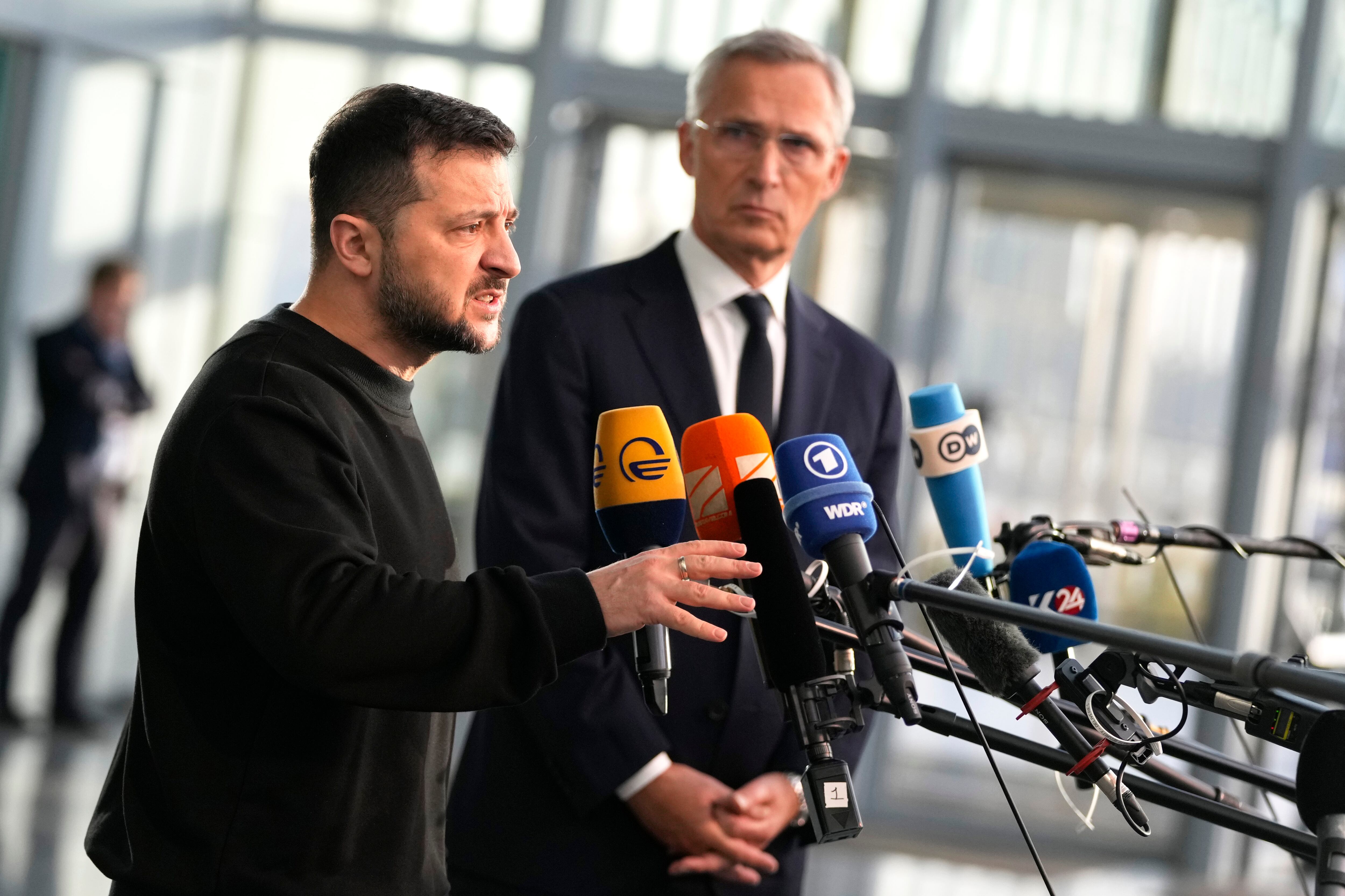 Ukraine's President Volodymyr Zelenskyy, left, speaks during a media conference with NATO Secretary General Jens Stoltenberg prior to a meeting of NATO defense ministers at NATO headquarters in Brussels, Wednesday, Oct. 11, 2023.