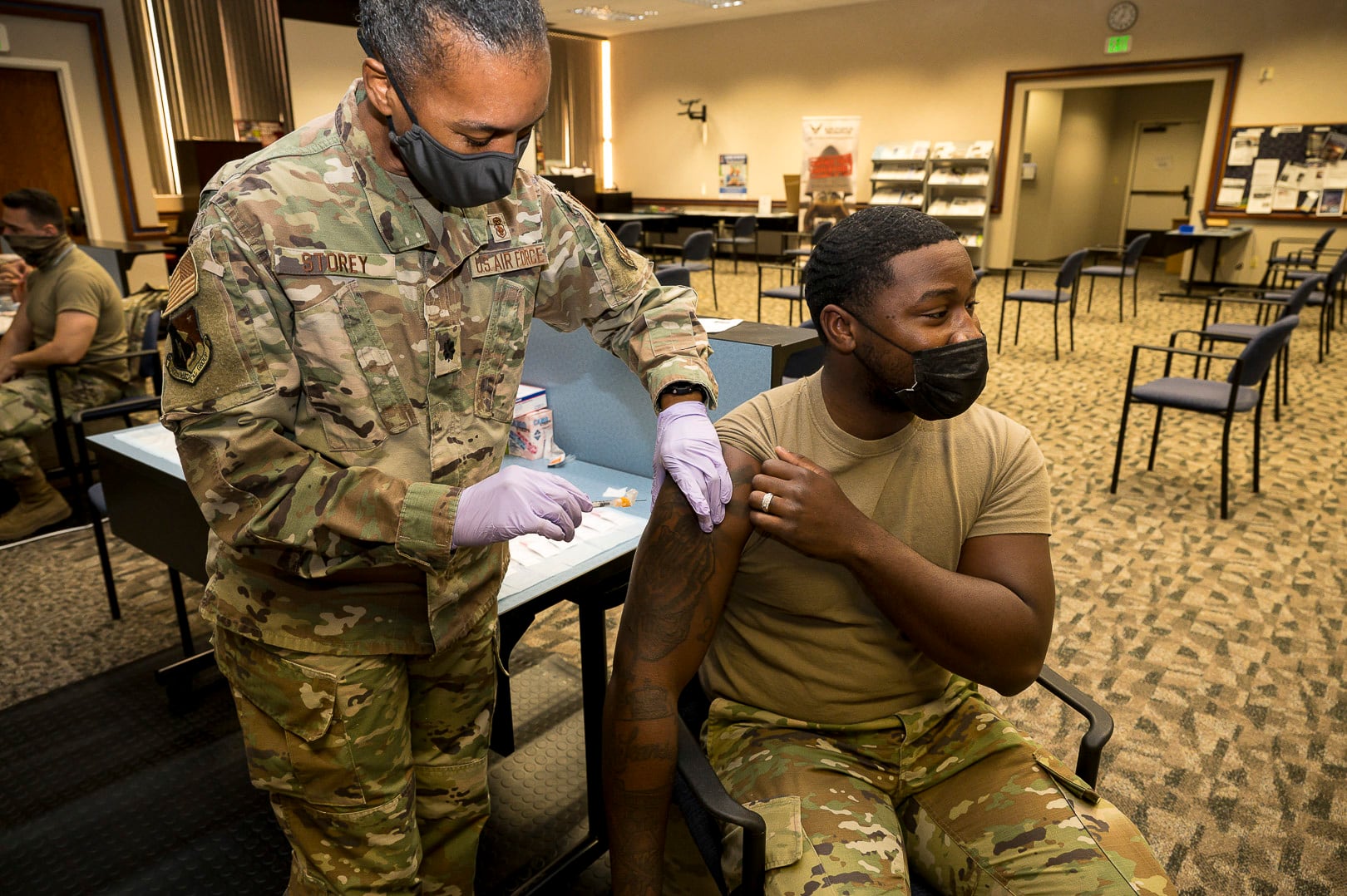 Senior Airman Rendall Powell of the 412th Test Wing receives a COVID-19 vaccination shot from Lt. Col. Yvonne Storey at Edwards Air Force Base, California, Aug. 25, 2021. (Katherine Franco/Air Force)