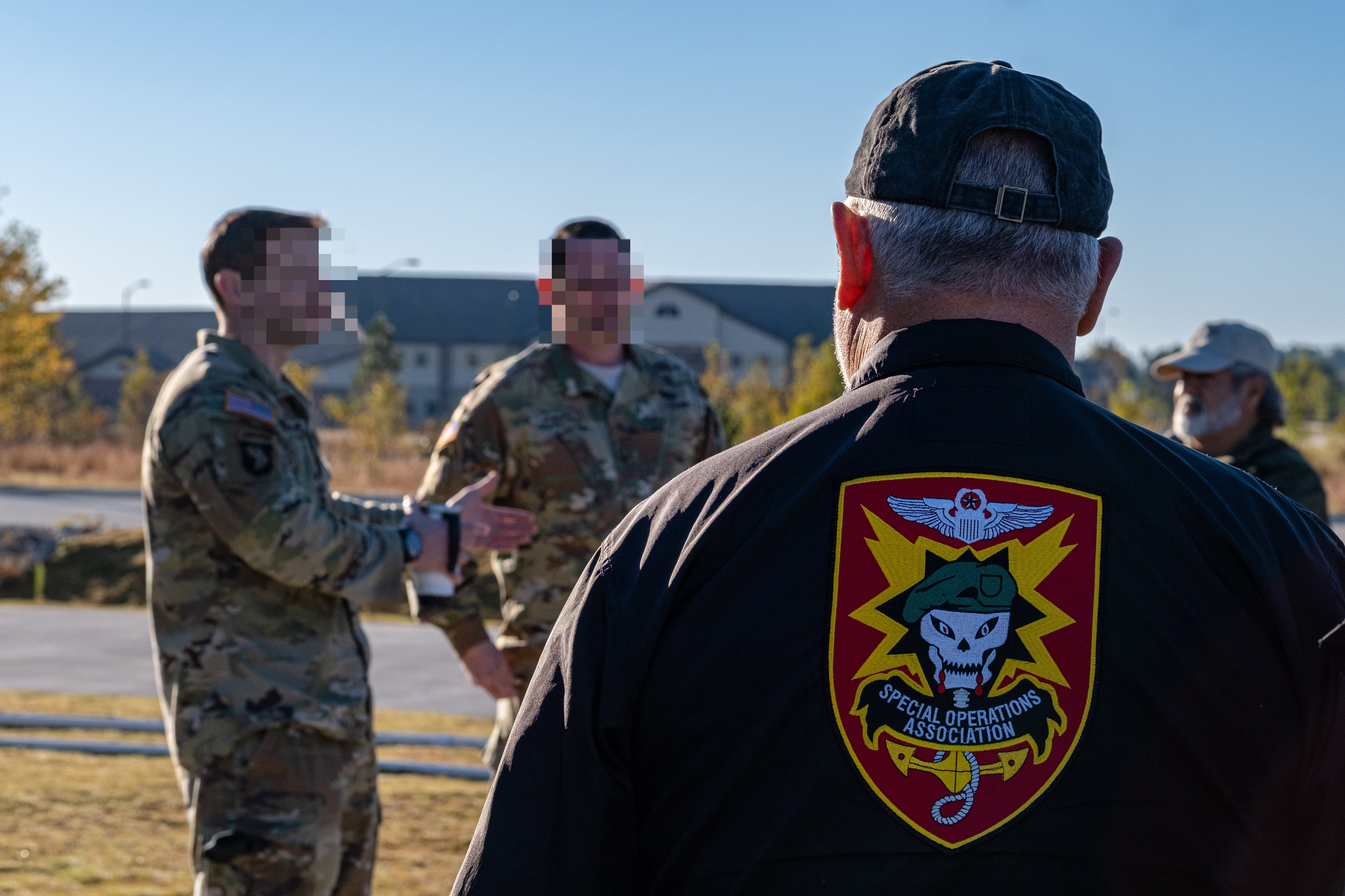 A Military Assistance Command, Vietnam-Studies and Observations Group, or MACV-SOG, veteran, listens to active service members with 3rd Special Forces Group (Airborne) as part of the MACV-SOG Heritage Week, Fort Bragg N.C., Nov. 9, 2021.