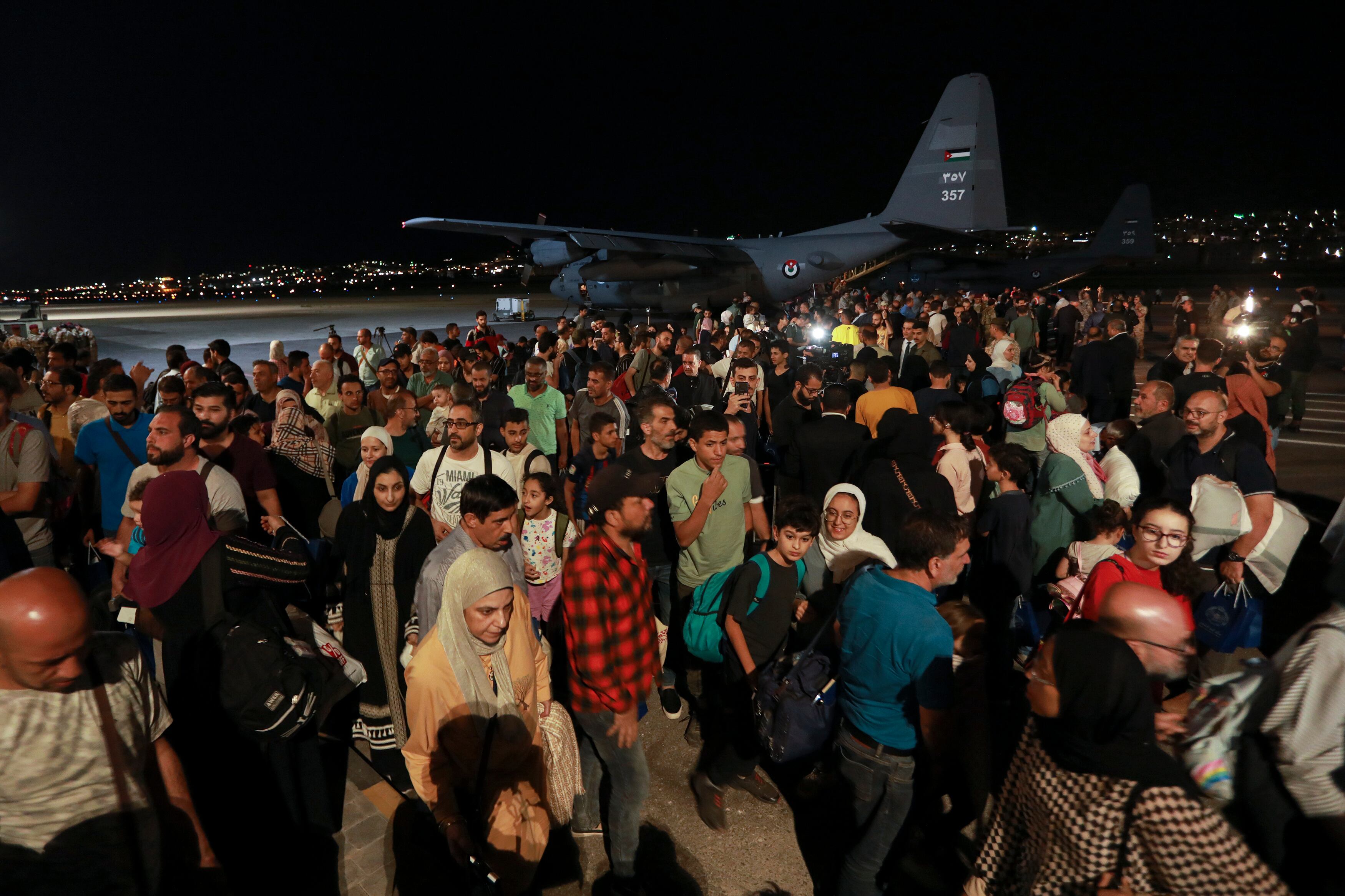 Jordanians evacuated from Sudan arrive at a military airport in Amman, Jordan, Monday, April 24, 2023.