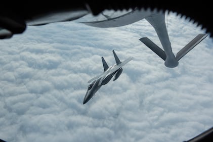 An F-15C Eagle from Kadena Air Base, Japan, flies away from a KC-135 Stratotanker after conducting aerial refueling during RED FLAG-Alaska 19-3 at Eielson Air Force Base, Alaska, Aug. 7, 2019.