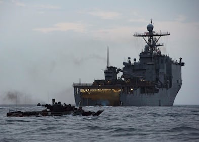 Assault amphibious vehicles transit toward land Aug. 15, 2019, after exiting the well deck of the amphibious dock landing ship USS Harpers Ferry (LSD 49) in the Gulf of Aden.