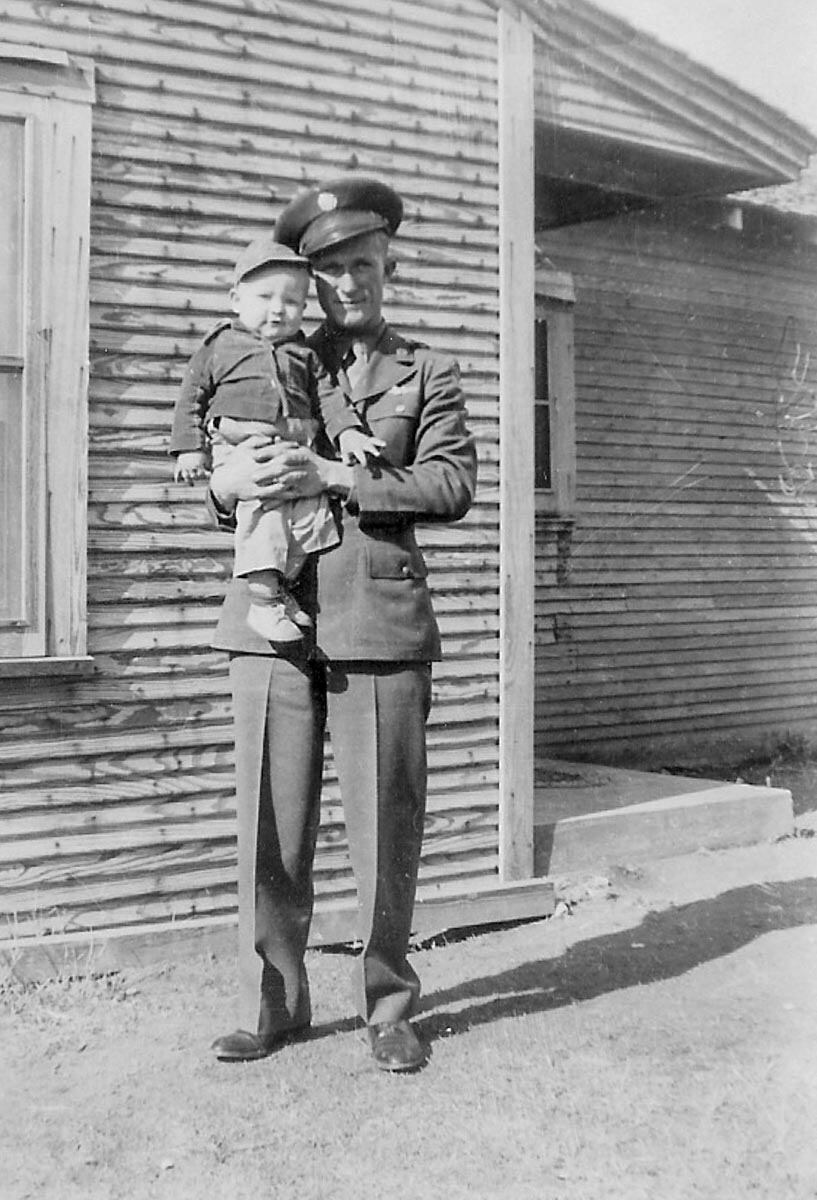 SSgt. Jimmie Doyle, nose-gunner on B-24 Heaven Can Wait, with son, Tommy.