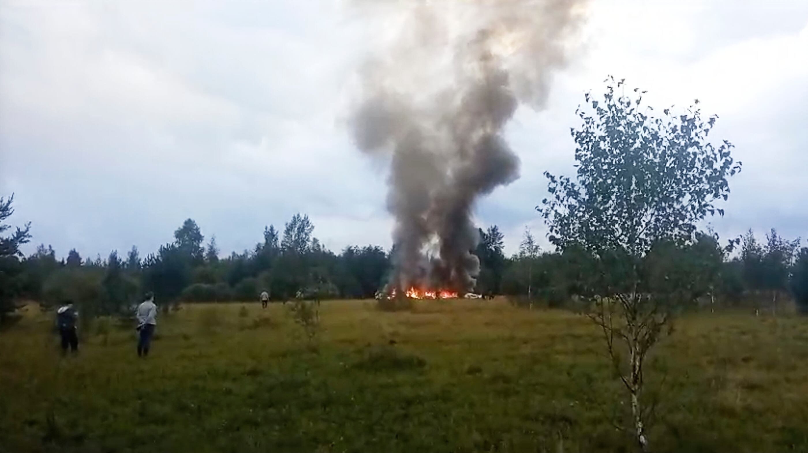 In this image taken from video, smoke and flames rise from a crashed private jet near the village of Kuzhenkino, Tver region, Russia, Wednesday, Aug. 23, 2023.