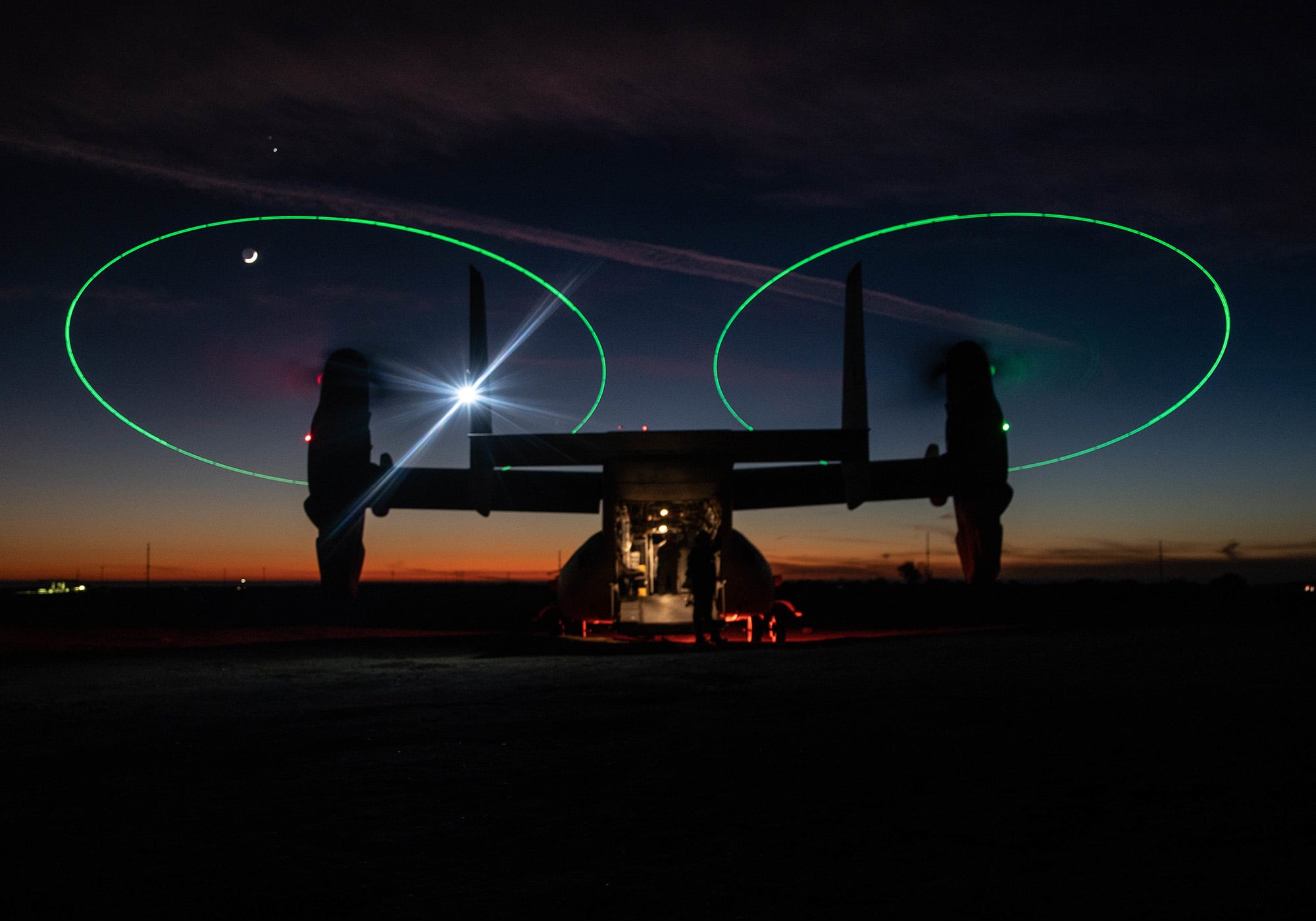 An MV-22 Osprey stages during a night during a Tactical Recovery of Aircraft and Personnel (TRAP) exercise at Marine Corps Base Camp Pendleton, Calif., Dec. 16, 2020.