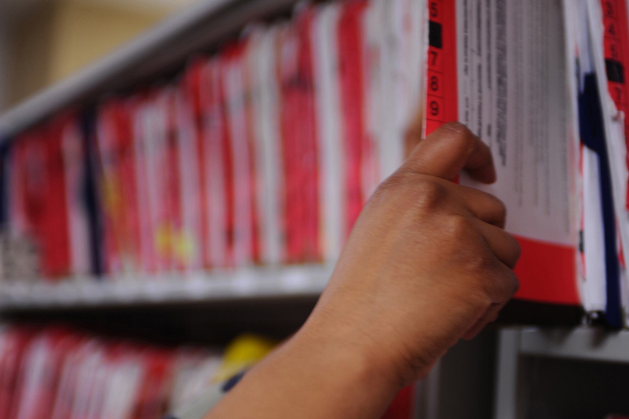 A service member shelves patient medical records at Ellsworth Air Force Base, S.D., March 26, 2009.