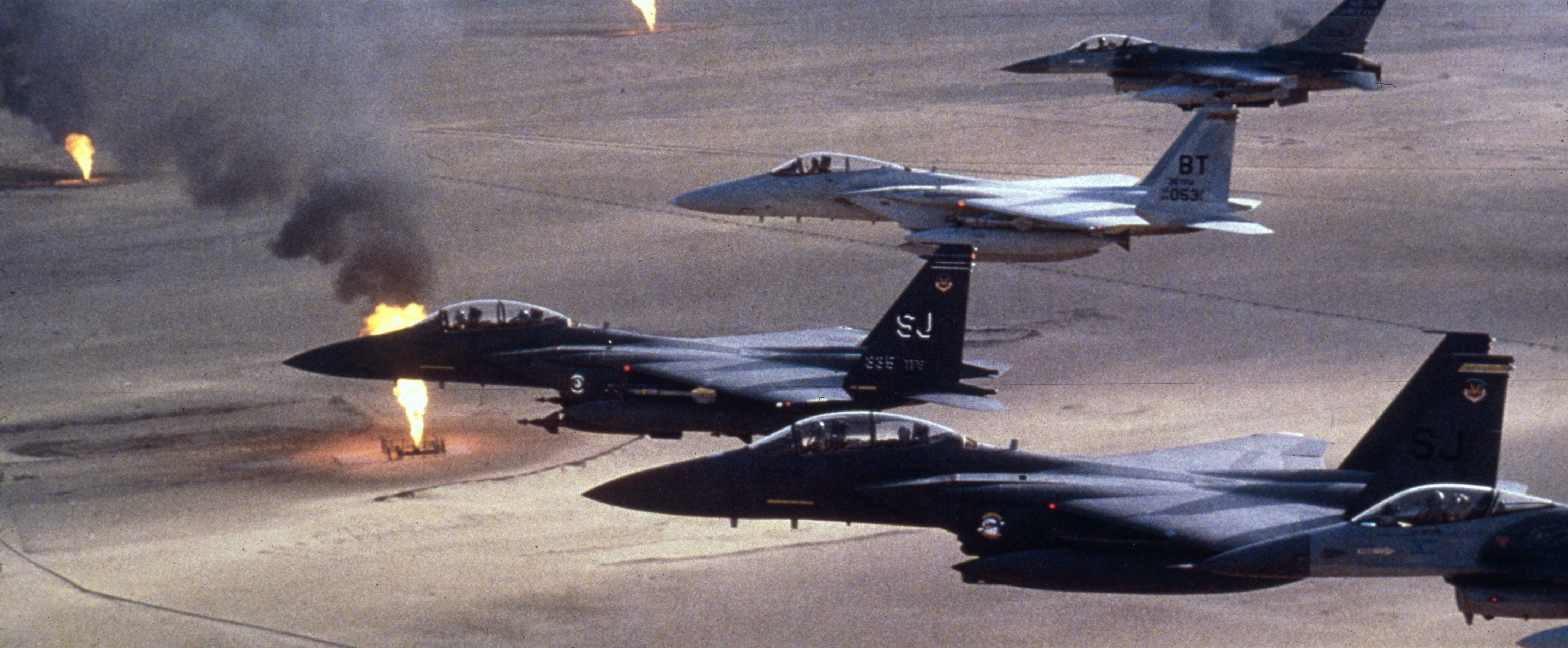 American Air Force F-15 C fighters fly over a Kuwaiti oilfield which had been torched by retreating Iraqi troops during the Gulf War.