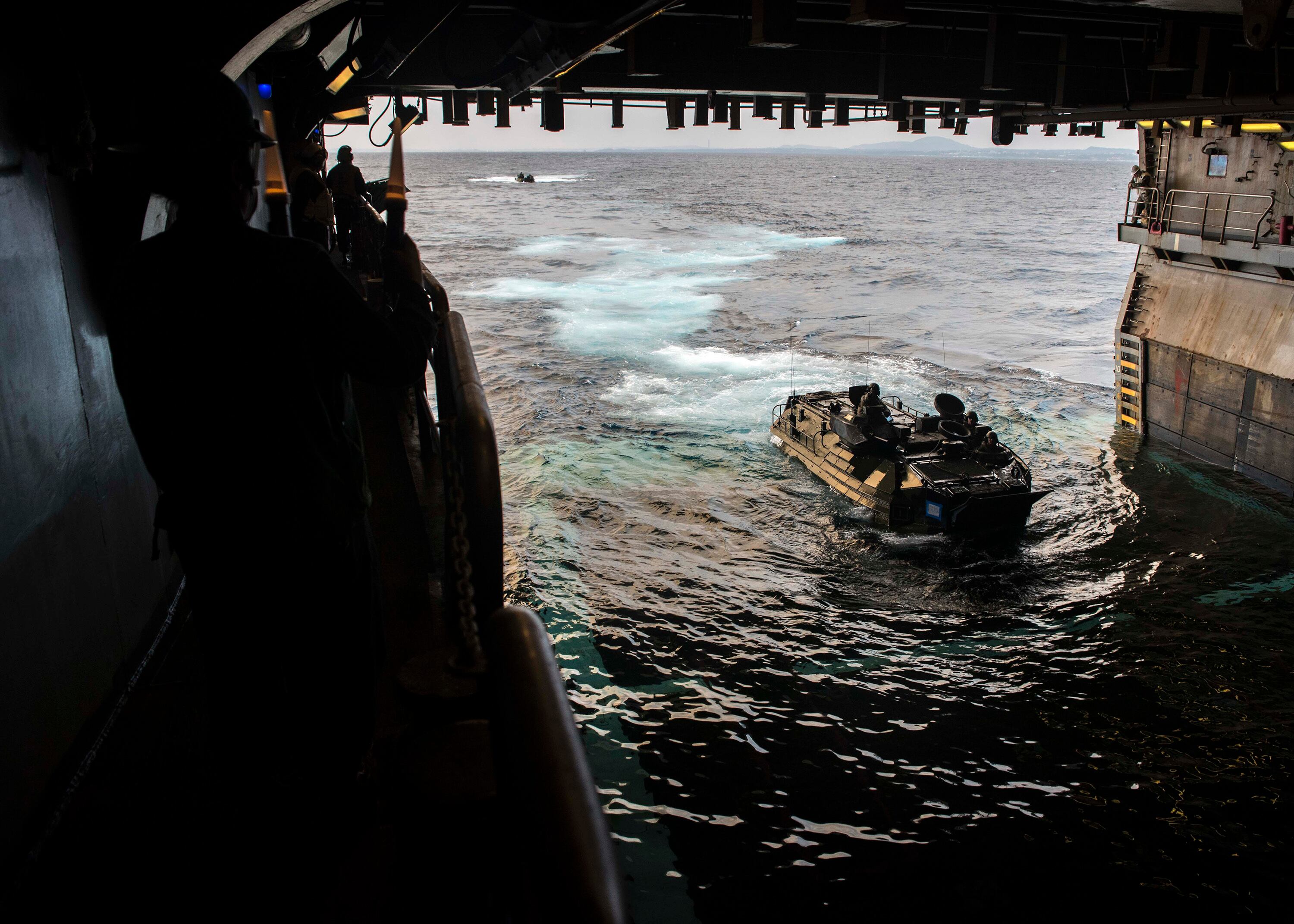 An assault amphibious vehicle assigned to the 31st Marine Expeditionary Unit enters the well deck of the amphibious assault ship Wasp on Jan. 14, 2019.